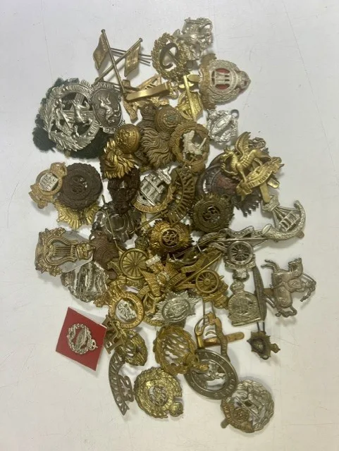 A large collection of early 20th century cap badges, collar badges and shoulder titles to include London Rifle Brigade, Army cyclist, Liverpool Scottish