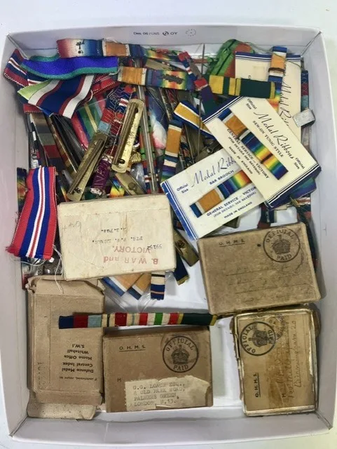 A collection of British Military Bar Brooch bars, Dress Ribbon bar frames, O.H.M.S boxes (empty), Wounded bars etc (Qty)