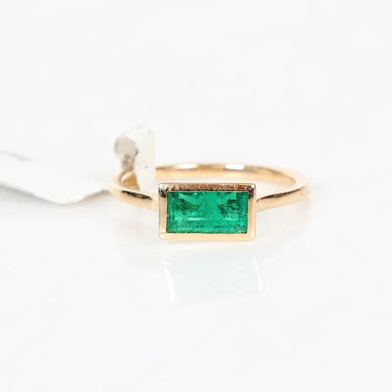 A 14 Carat Gold & Emerald Ring