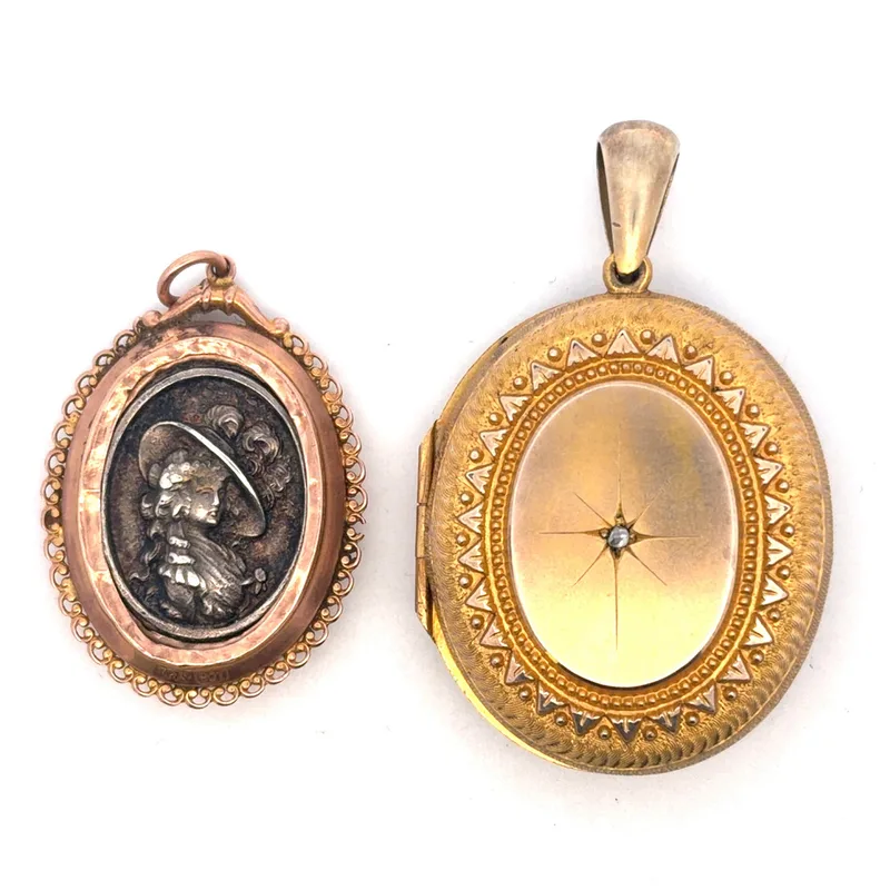Two Yellow Metal Pendants