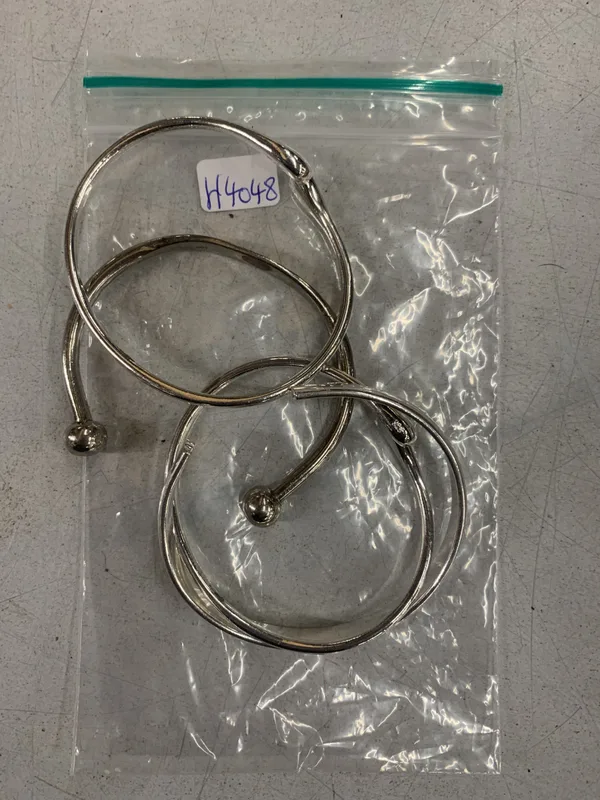 A Collection of White Metal Bangles